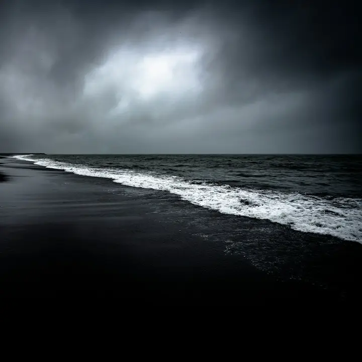 Cover of Sturmflut: a black beach under storm clouds, white surf breaking.